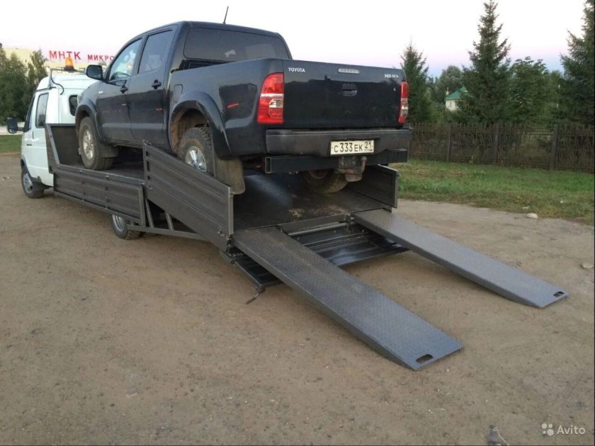 Сдвижная эвакуаторная платформа с бортами