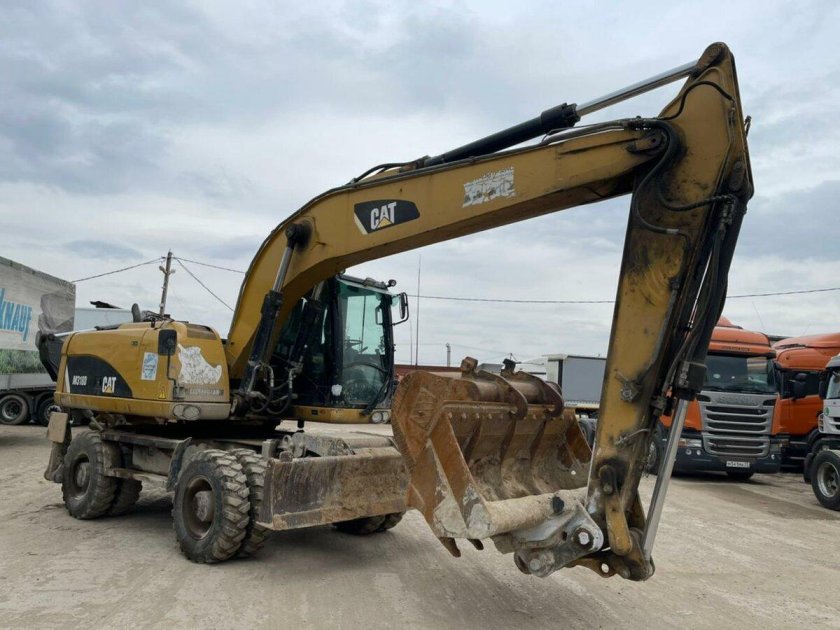 Полноповоротный экскаватор caterpillar m315