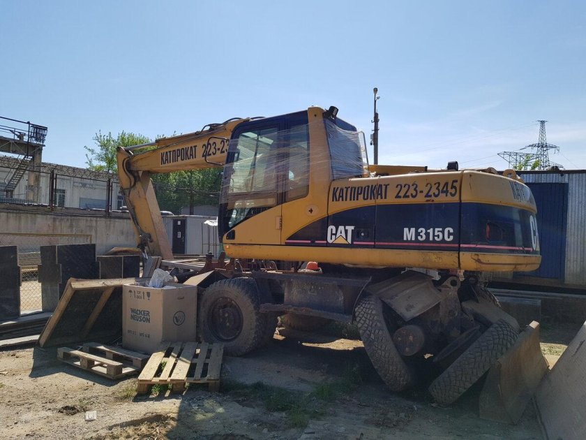 Экскаватор катерпиллер 318
