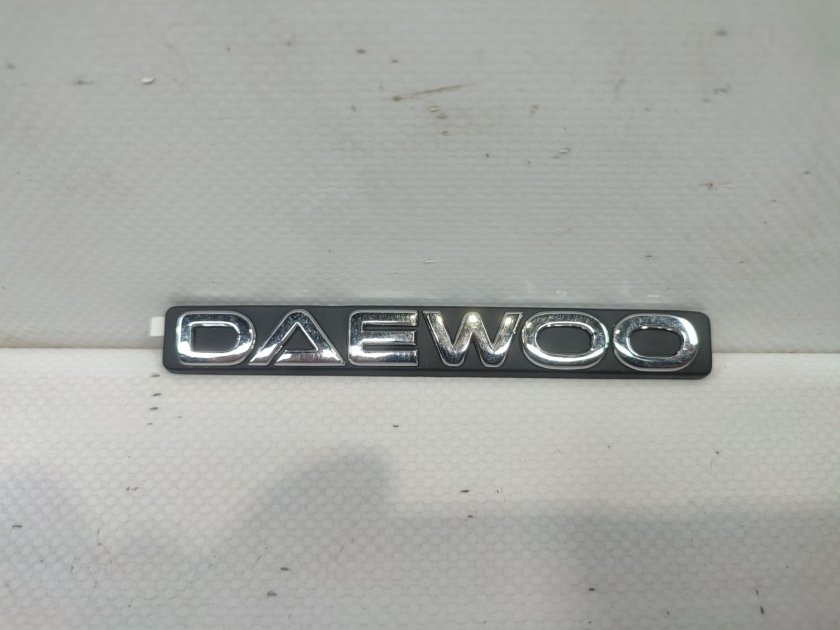 Логотип Нексия на задний бампер