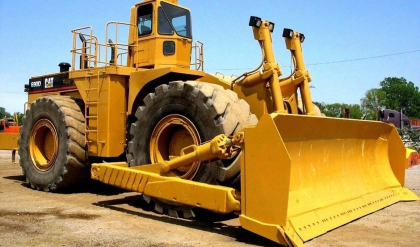 Колесный бульдозер катерпиллер