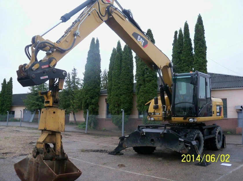 Катерпиллер экскаватор колесный