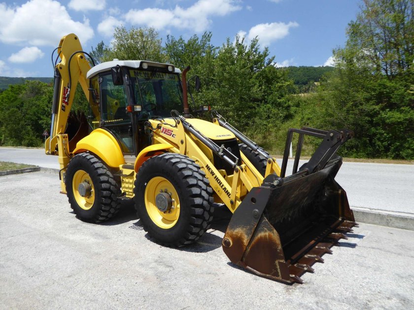 Нью Холланд экскаватор погрузчик