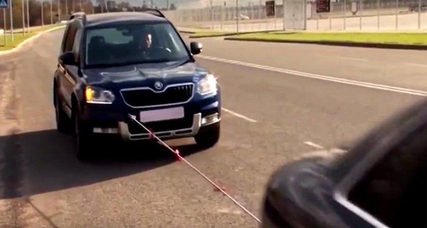 Буксировать машину