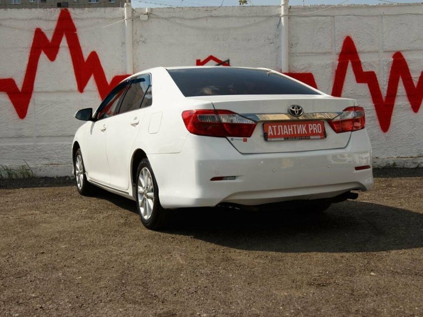 Yellow Toyota Camry back view
