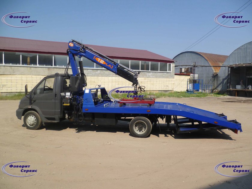 Эвакуатор с ломаной платформой Валдай-1