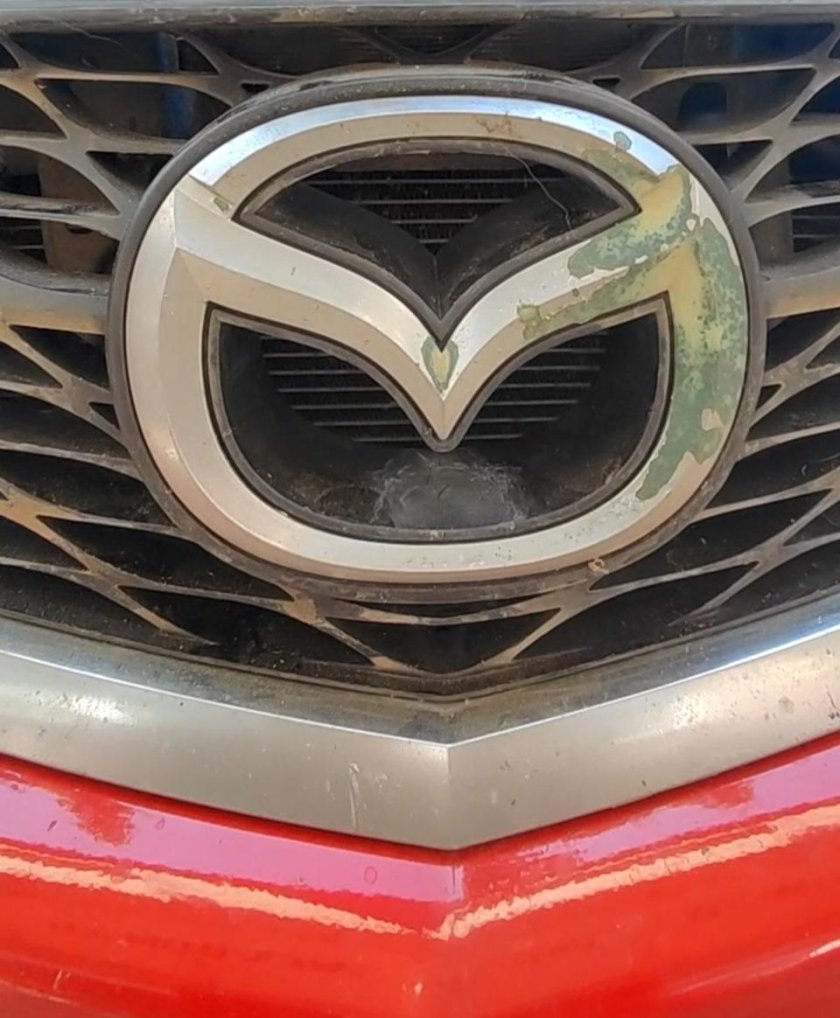 Эмблема мазда