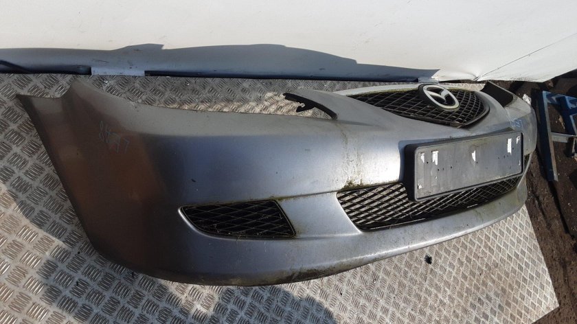 Бампер передний без отверстий под противотуманки Renault Logan 2011г цвет KNM