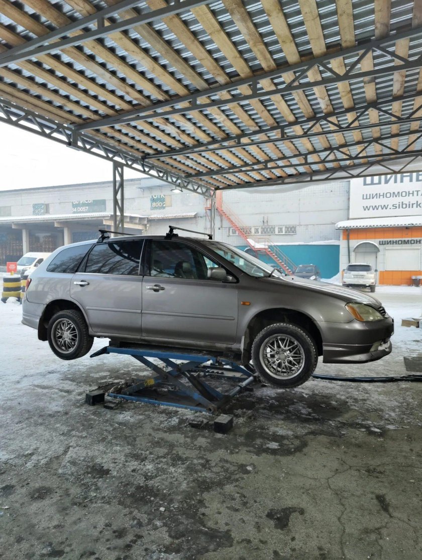 Где находится регулировочный болт на задних колёсах Хонда Авансир