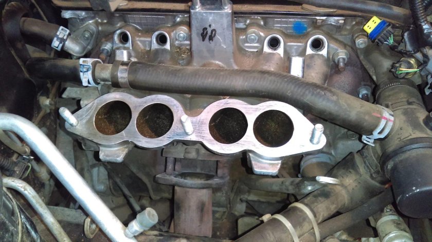 Патрубок под коллектором Нива Шевроле