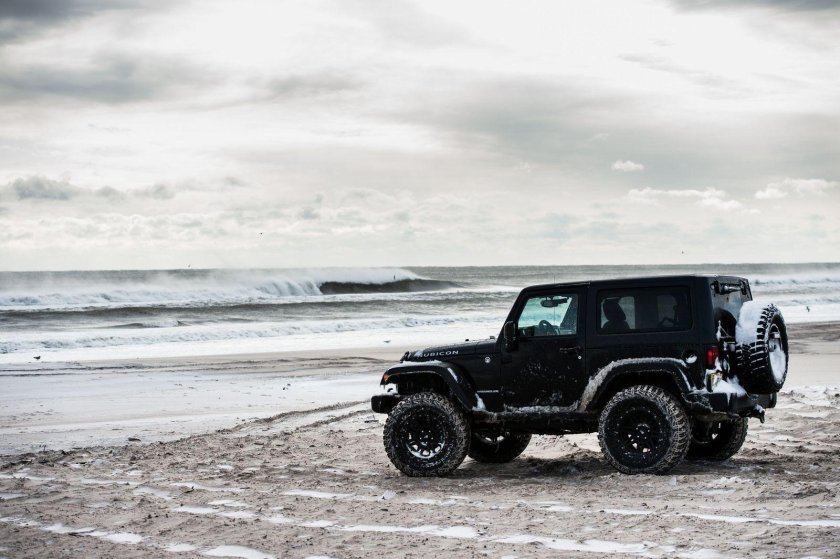The Jeep is in the Snow picture