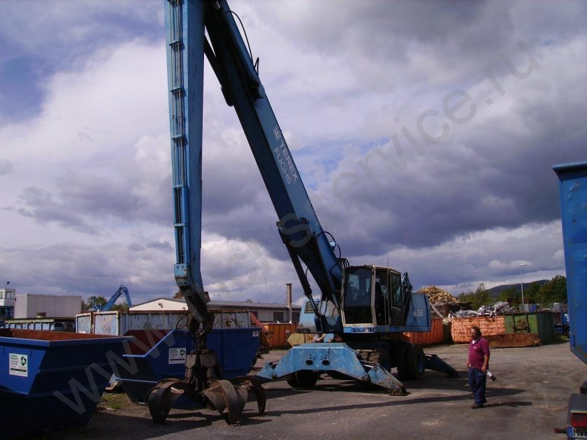 Fuchs MHL 360 грейферный погрузчик