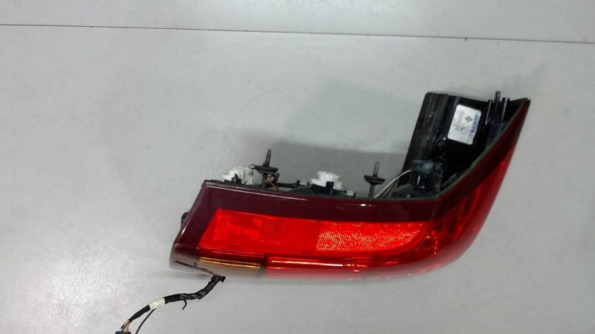 Фонарь левый задний Кадиллак БЛС