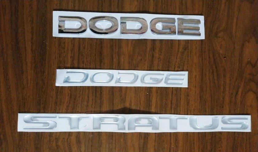 Додж шильдик