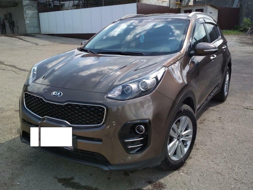 Kia Sportage IV 2.0 at (150 л.с.) б/у коричневый на снегу