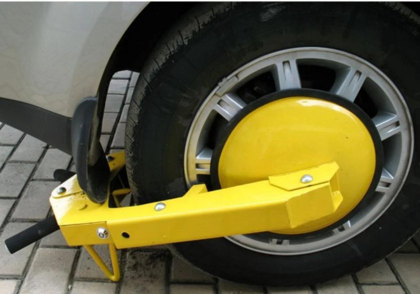 Блокировочный башмак на колесо